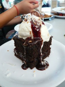 Chocolate cake with raspberry jam, honey bun ice cream, chocolate raspberry sauce and toasted coconut